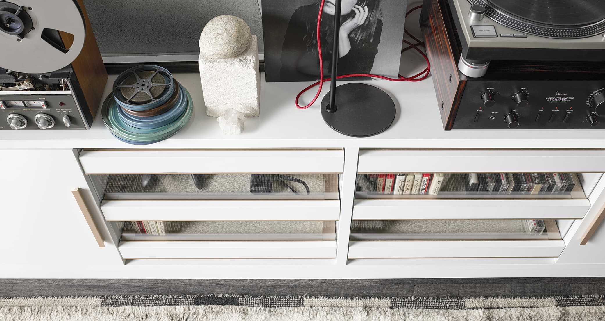 Music center with built-in entertainment center shelving in white wood finish by California Closets