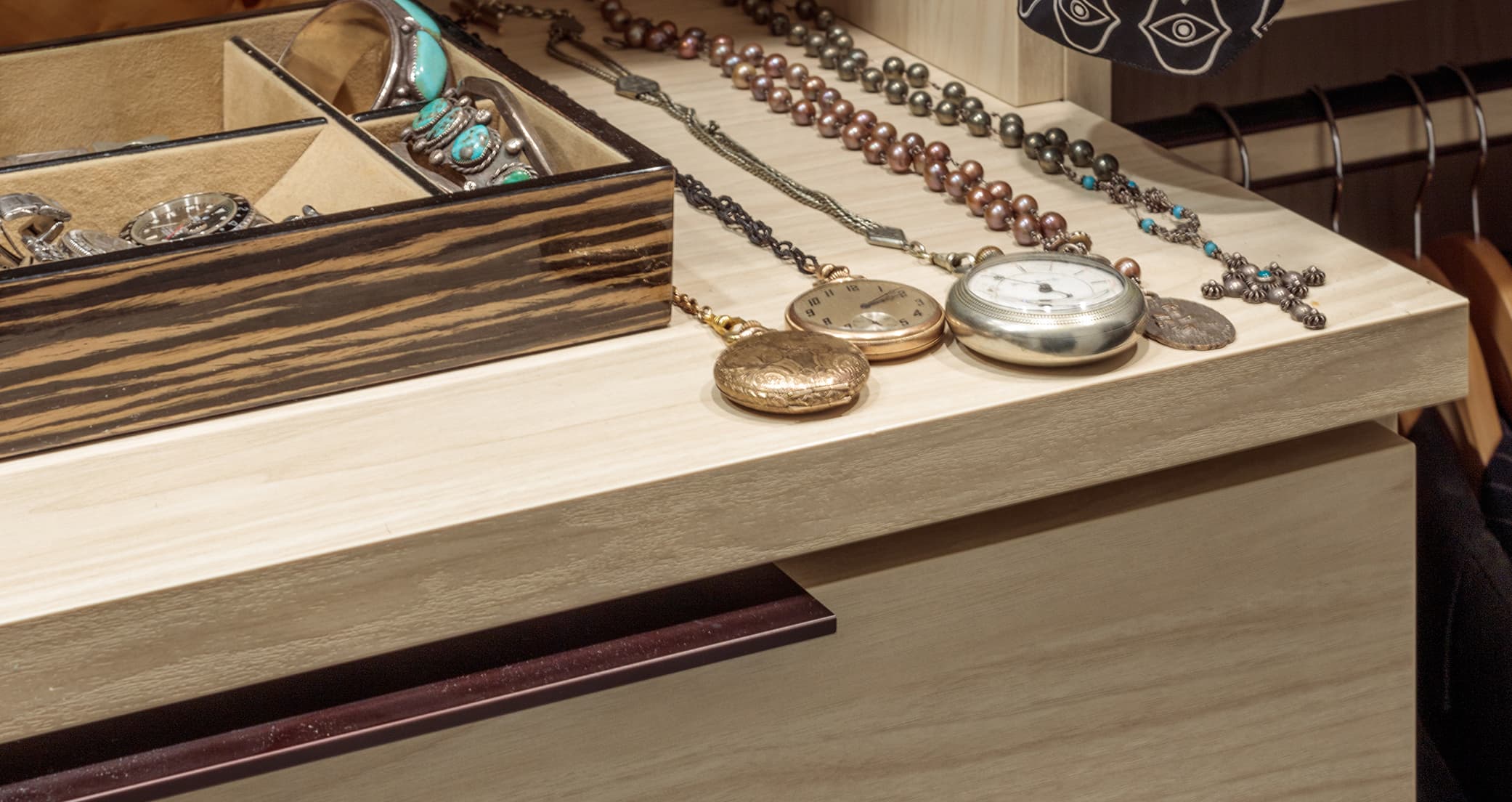 Matt Sorum and Ace Harper's custom closet with jewerly cabinet in wood finish by California Closets