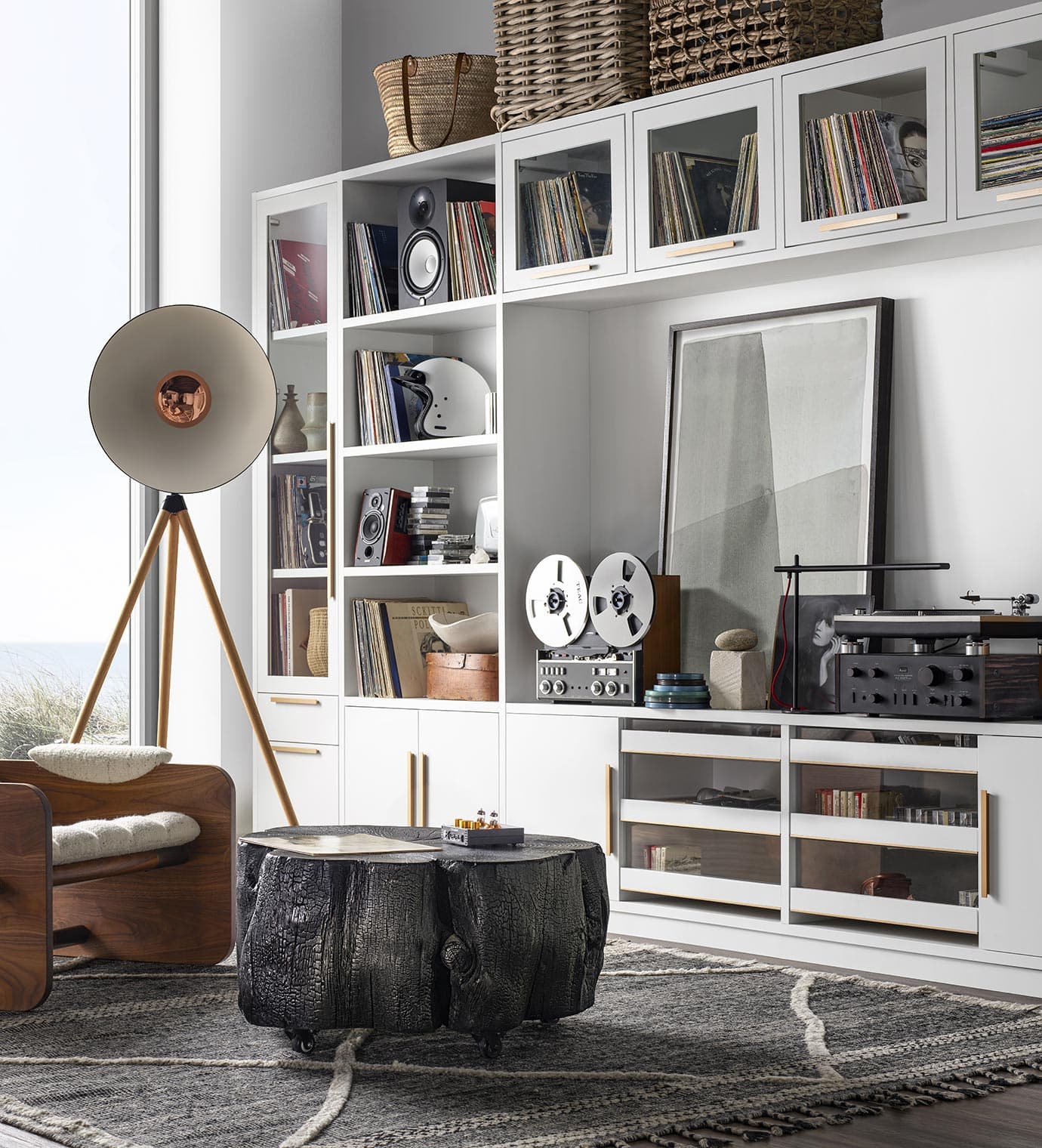 Retro-designed loft with custom entertainment center storage in white wood finish by California Closets