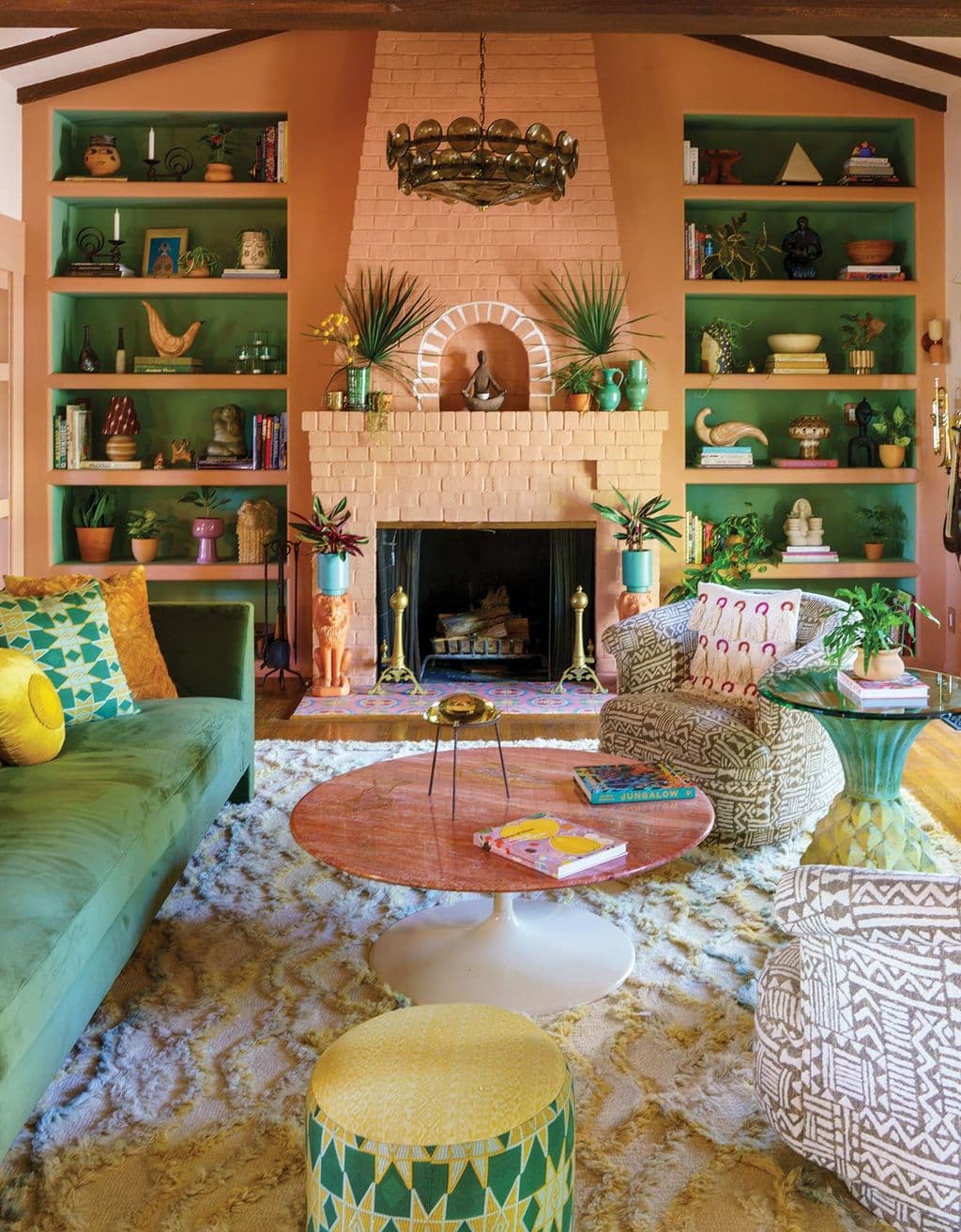 Living room shelves in terra cotta and green finishes from Justina Blakeney in Ideas of Order Magazine