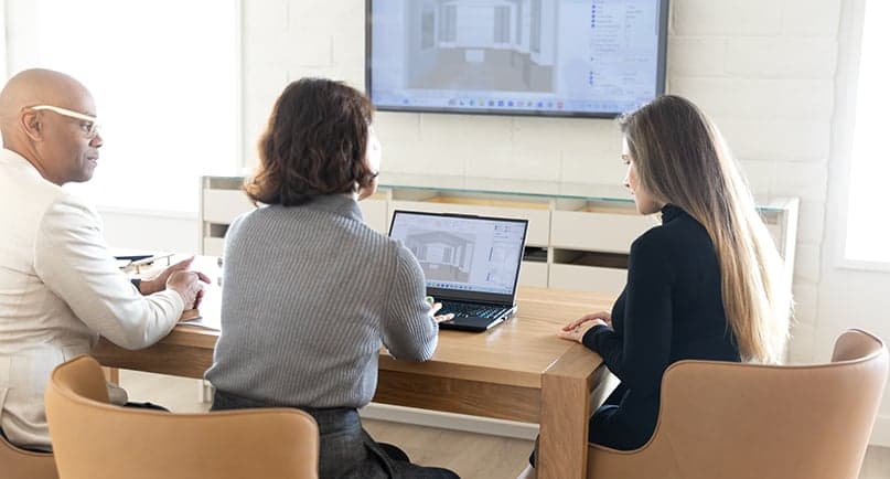 In home design consultation with a professional designer taking notes on the space and measurements by California Closets